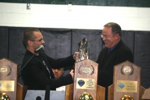 Trinity coach Bob Beatty received the national championship trophy. Photo courtesy LouisvilleCatholicSports.com.